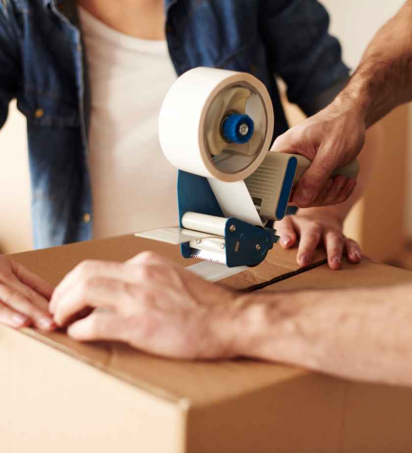 close-up-of-human-hands-sticking-cartons