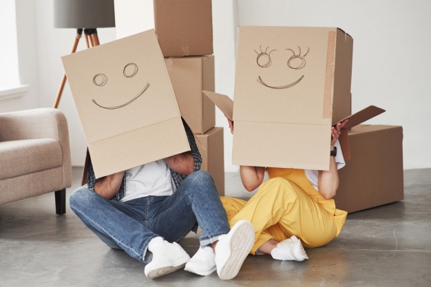 people-with-cardboard-boxes-on-heads